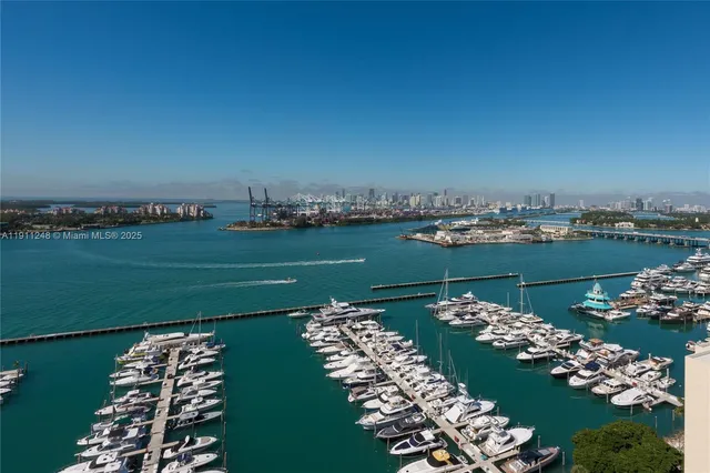 a view of a terrace with lawn chairs