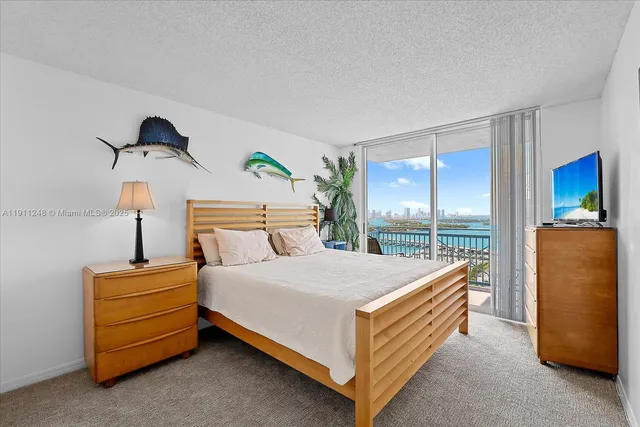 a bed room with a bed and a chair