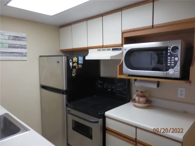 a kitchen with a cabinets and a stove
