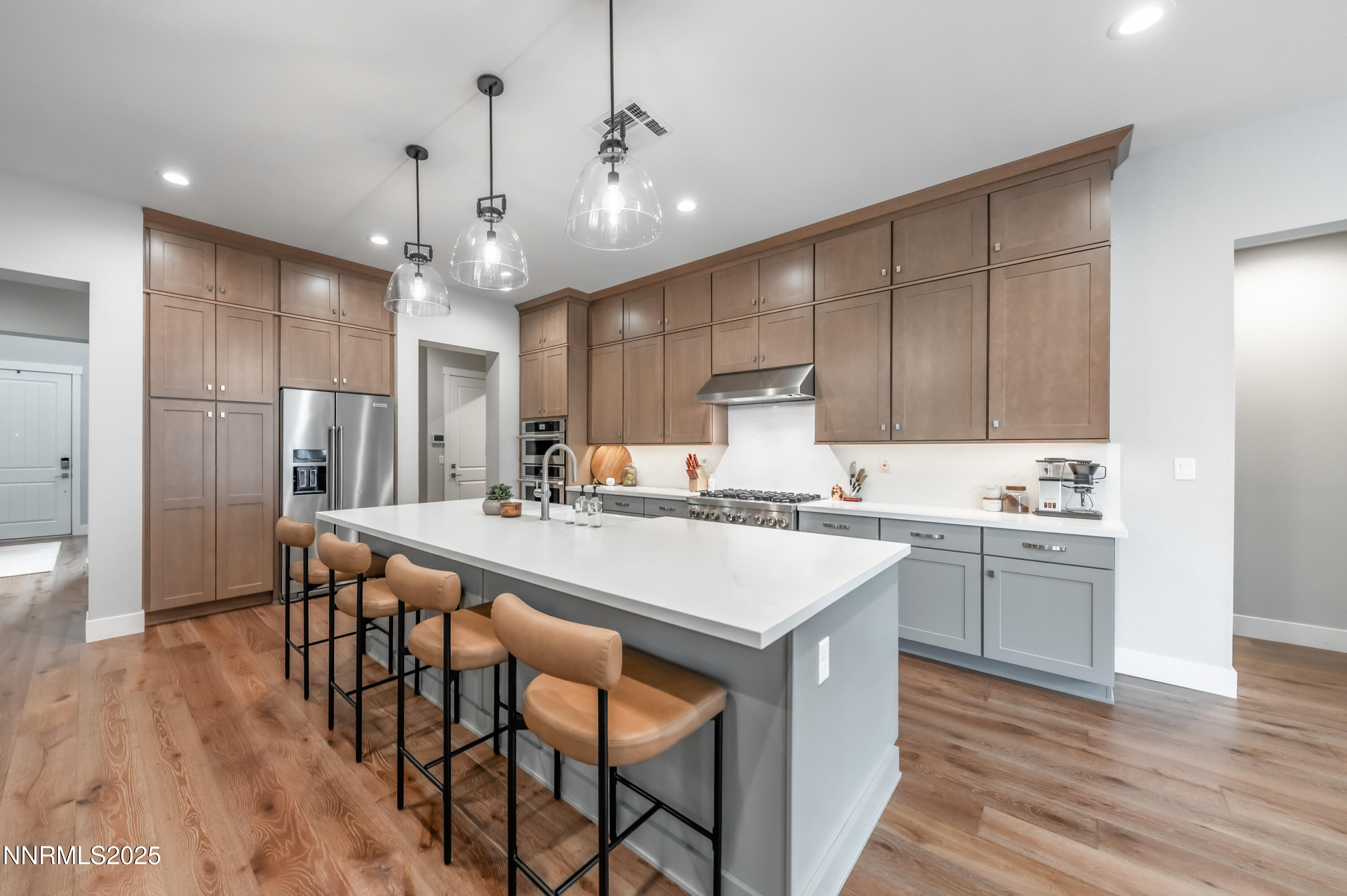 5453 Side Saddle Trail Reno, NV 89511 - Photo 11 of 33 a large kitchen with kitchen island a sink table and chairs
