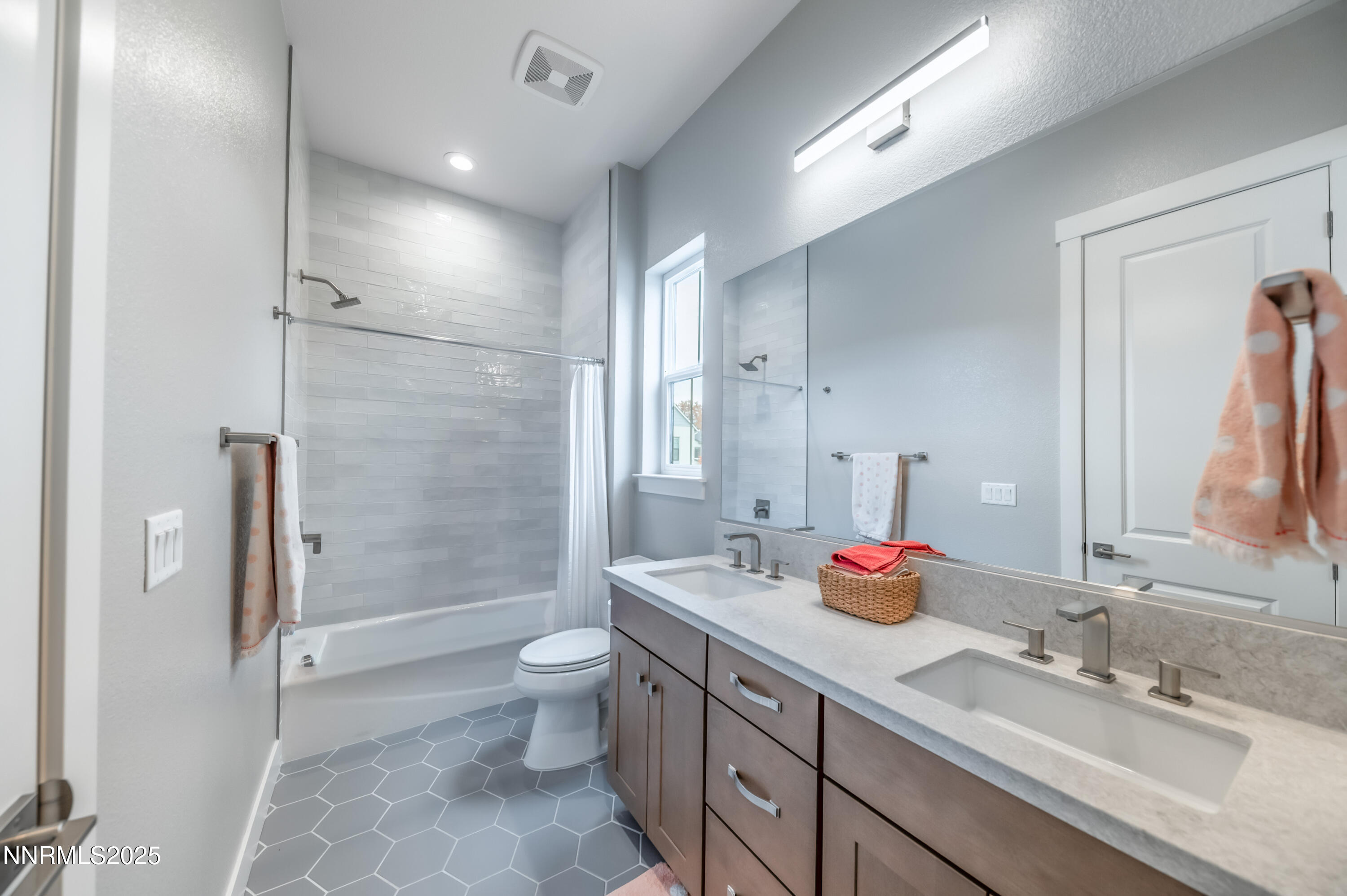 5453 Side Saddle Trail Reno, NV 89511 - Photo 24 of 33 a bathroom with a double vanity sink mirror double shower and a toilet