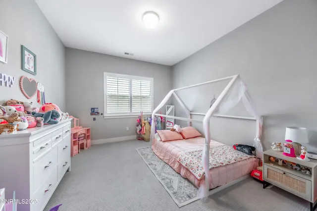 a bedroom with furniture and a bed