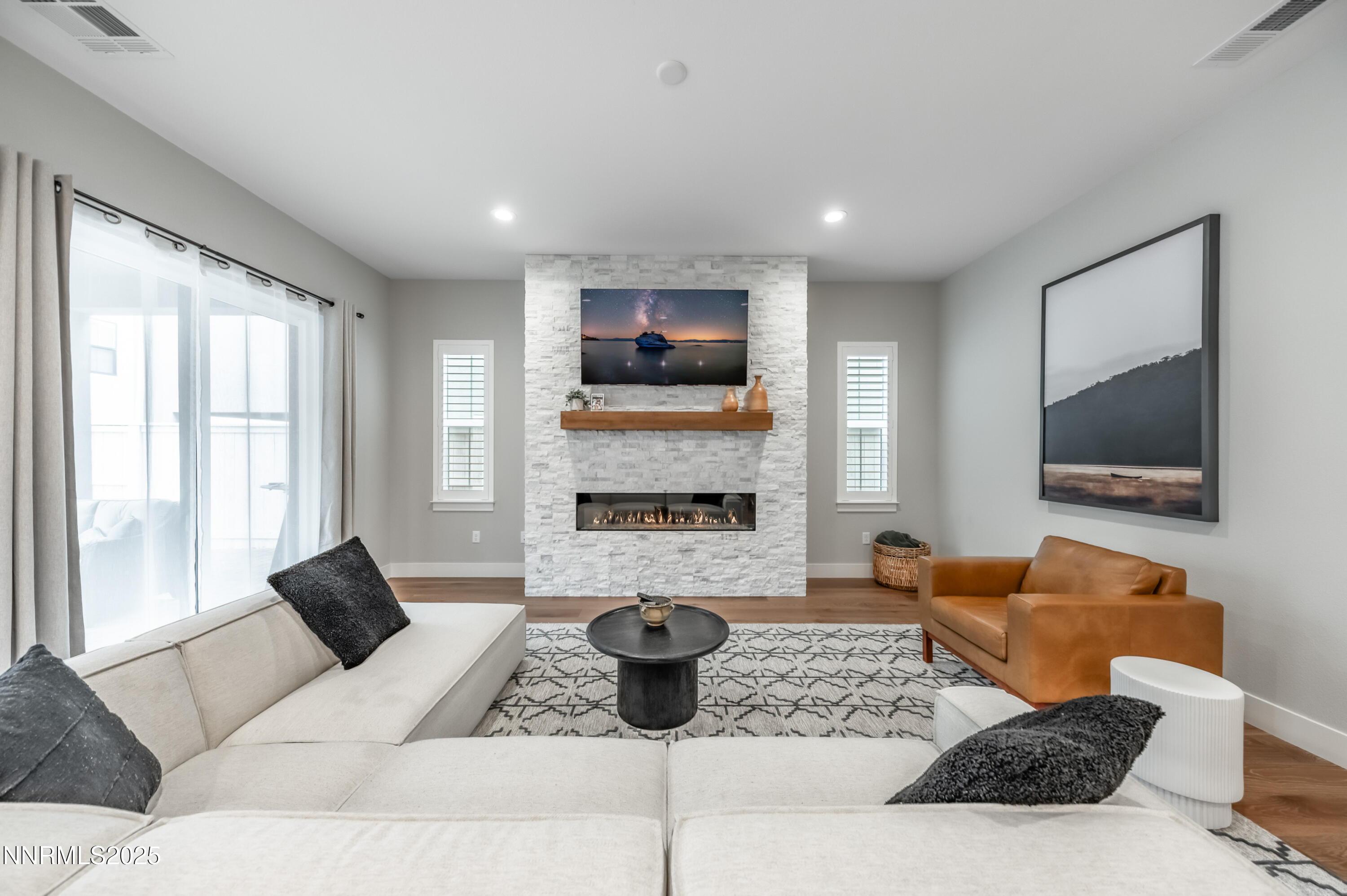 5453 Side Saddle Trail Reno, NV 89511 - Photo 8 of 33 a living room with furniture and a flat screen tv