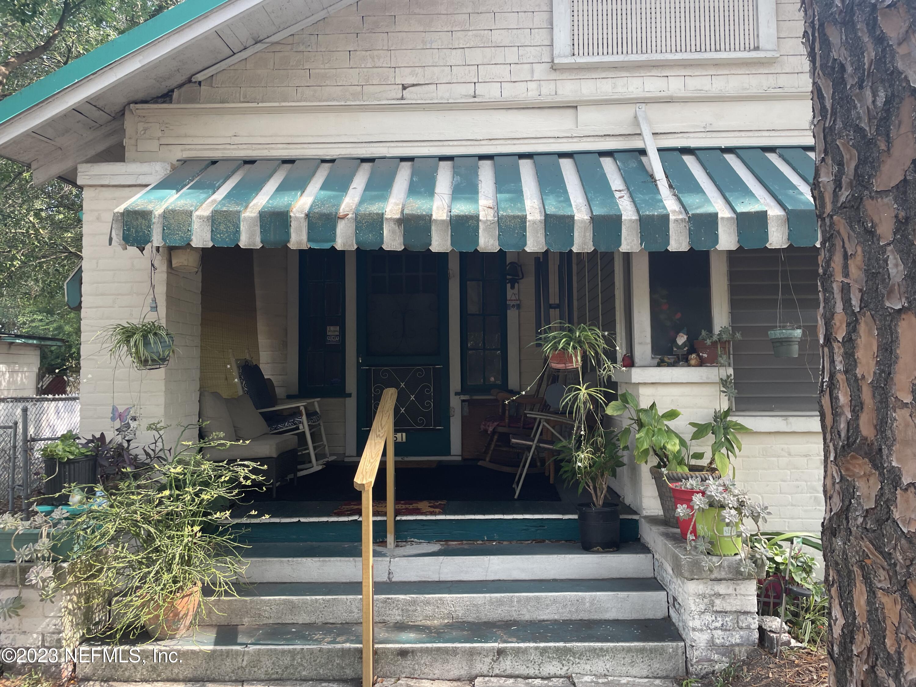 51 East 17th Street Jacksonville, FL 32206 - Photo 2 of 14 a view of a patio with table and chairs potted plants
