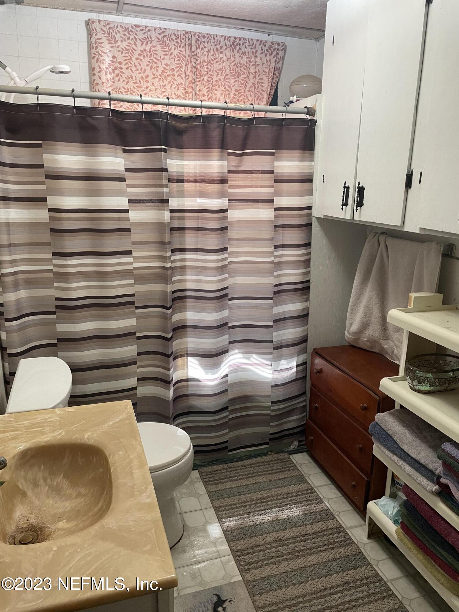 51 East 17th Street Jacksonville, FL 32206 - Photo 6 of 14 a bathroom with a toilet and a sink