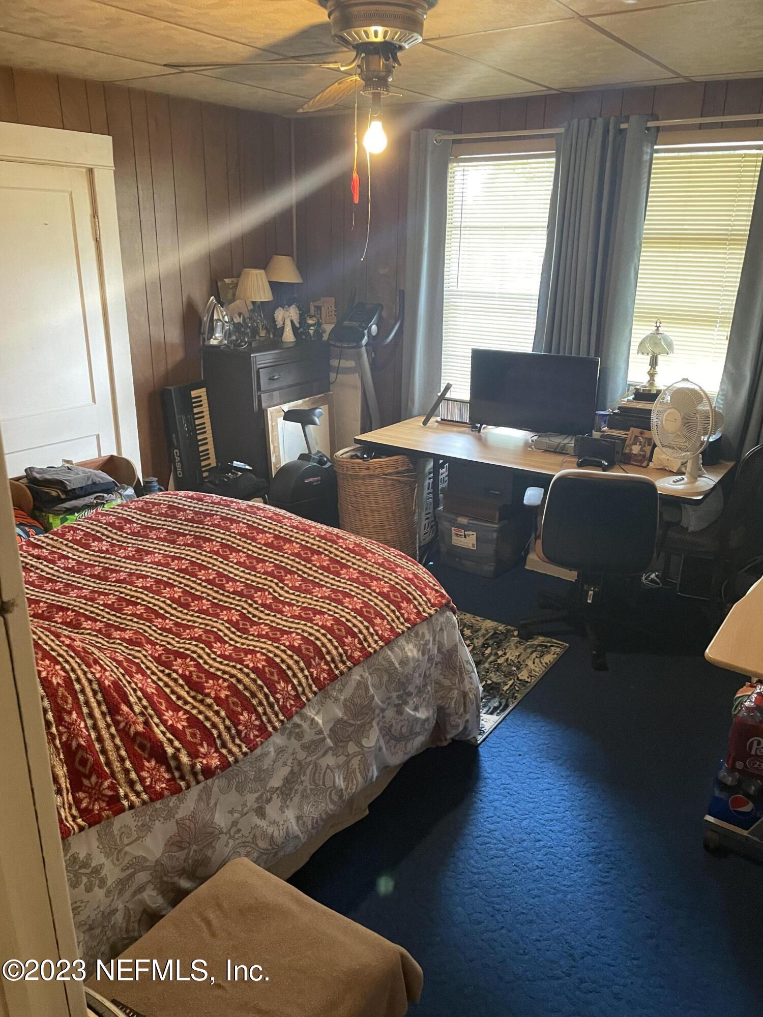 51 East 17th Street Jacksonville, FL 32206 - Photo 9 of 14 a bed sitting in a bedroom next to a window