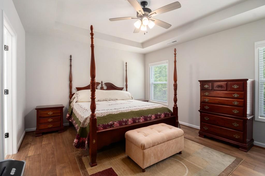 124 Willington Way Newnan, GA 30265 - Photo 13 of 41 a bedroom with a bed window and a ceiling fan