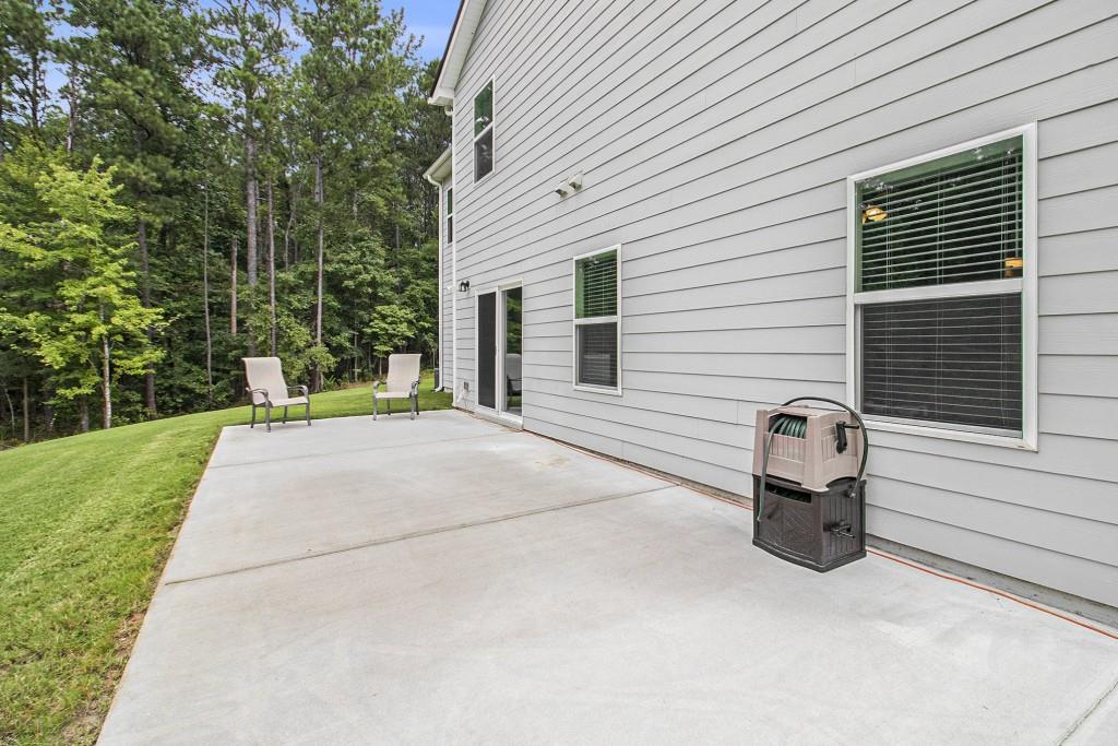 124 Willington Way Newnan, GA 30265 - Photo 26 of 41 a backyard view of a house