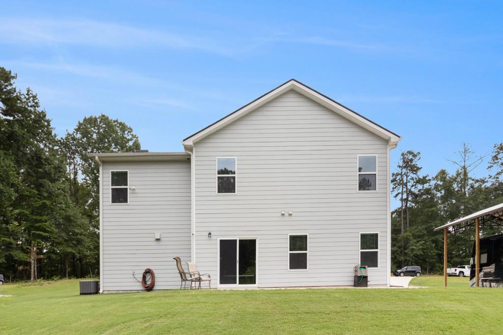 124 Willington Way Newnan, GA 30265 - Photo 29 of 41 a view of a house with a yard