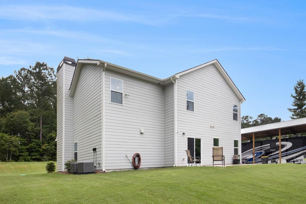 124 Willington Way Newnan, GA 30265 - Photo 31 of 41 a view of a house with backyard