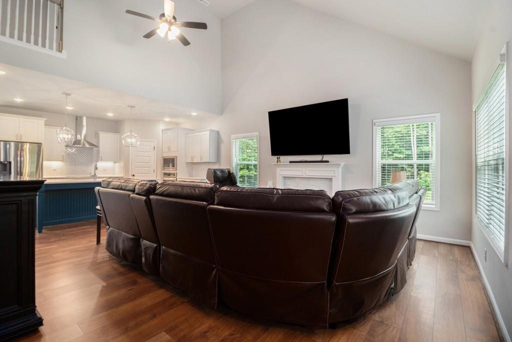 124 Willington Way Newnan, GA 30265 - Photo 4 of 41 a living room with furniture and a flat screen tv