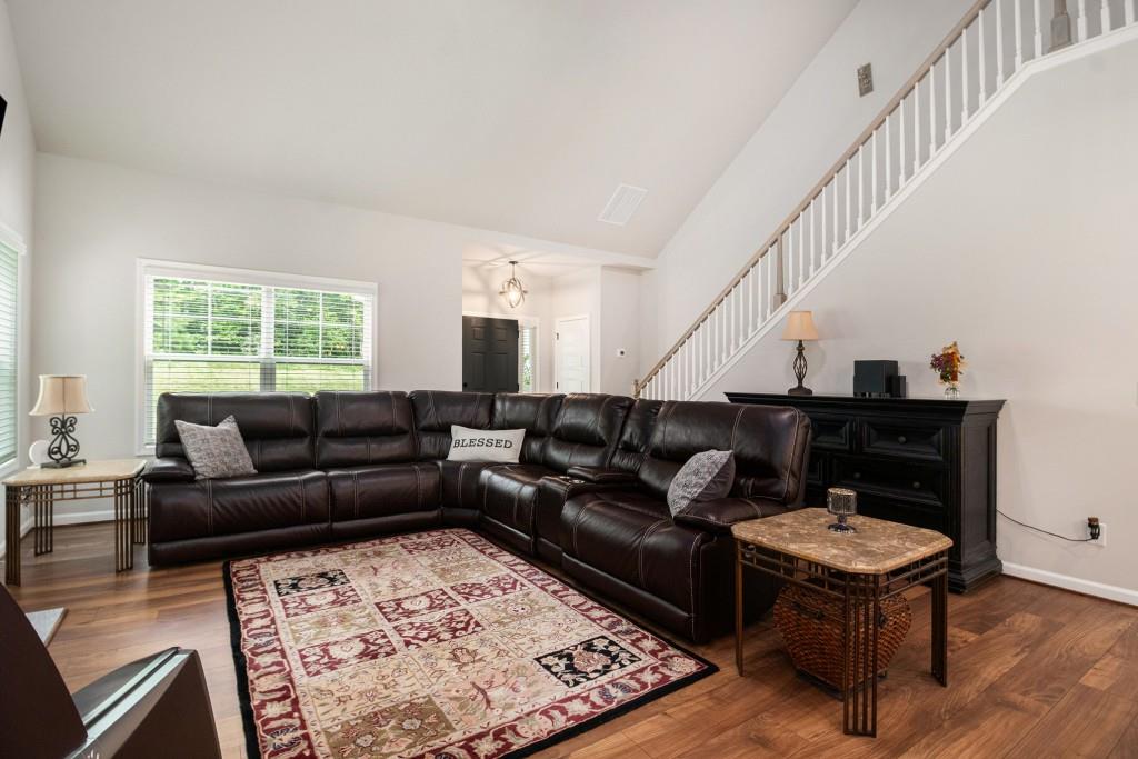 124 Willington Way Newnan, GA 30265 - Photo 6 of 41 a living room with furniture and a rug