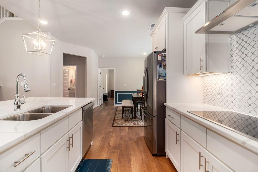 124 Willington Way Newnan, GA 30265 - Photo 9 of 41 a kitchen with white cabinets and sink
