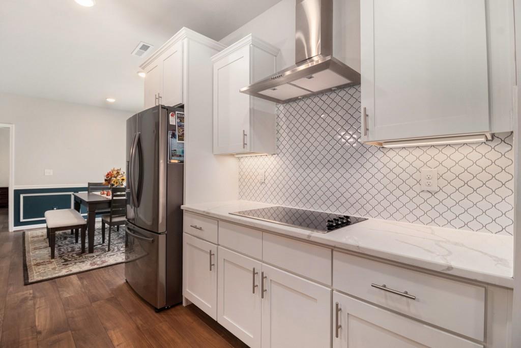 124 Willington Way Newnan, GA 30265 - Photo 10 of 41 a kitchen with a sink cabinets and wooden floor
