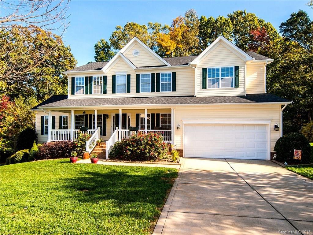 4415 Sunset Rose Drive Fort Mill, SC 29708 - Photo 1 of 24 a front view of a house with a yard and porch