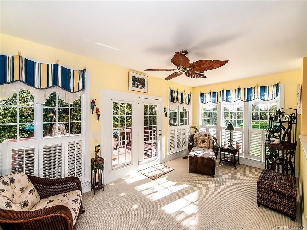 4415 Sunset Rose Drive Fort Mill, SC 29708 - Photo 12 of 24 a living room with furniture gym equipment and a large window