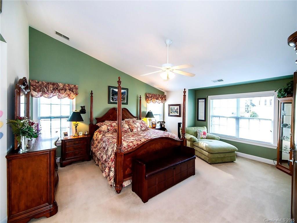 4415 Sunset Rose Drive Fort Mill, SC 29708 - Photo 14 of 24 a bedroom with a bed and a couch next to a window