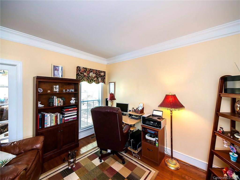 4415 Sunset Rose Drive Fort Mill, SC 29708 - Photo 9 of 24 a view of a workspace with furniture and a bookshelf