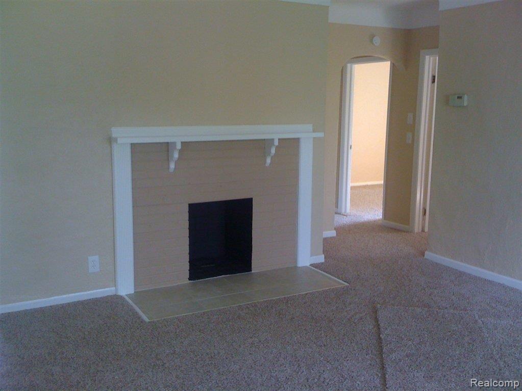 780 Collier Road Auburn Hills, MI 48326 - Photo 5 of 12 Cozy fireplace.JPG