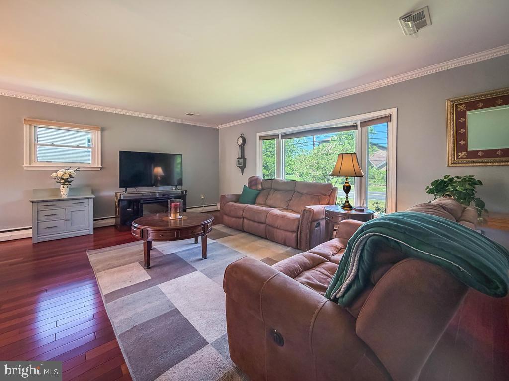 925 Big Oak Road Yardley, PA 19067 - Photo 7 of 51 a living room with furniture and a flat screen tv