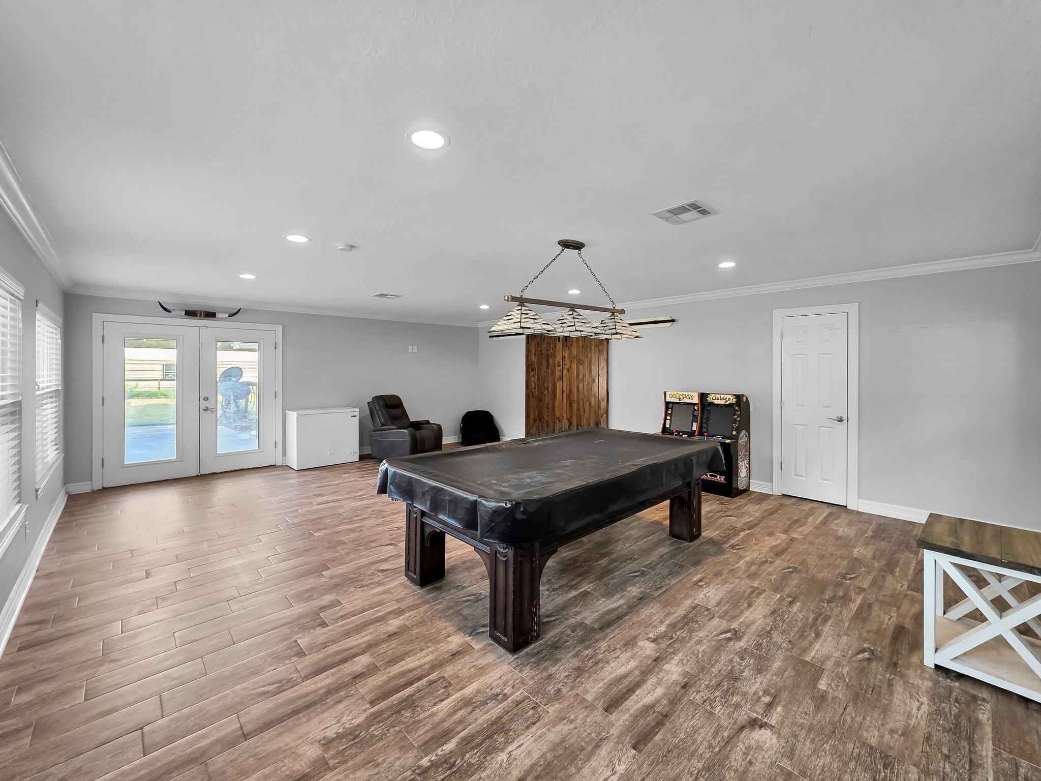 2641 Oilla Road Orange, TX 77630 - Photo 35 of 50 a living room with furniture a table and kitchen view