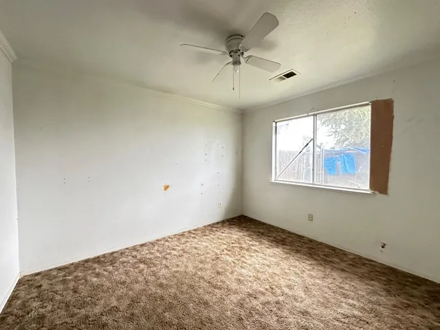 a view of a big room with windows