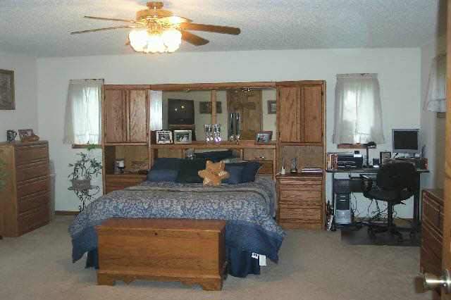 13900 West Howardsville Road Lena, IL 61048 - Photo 6 of 9 a living room with furniture and a chandelier