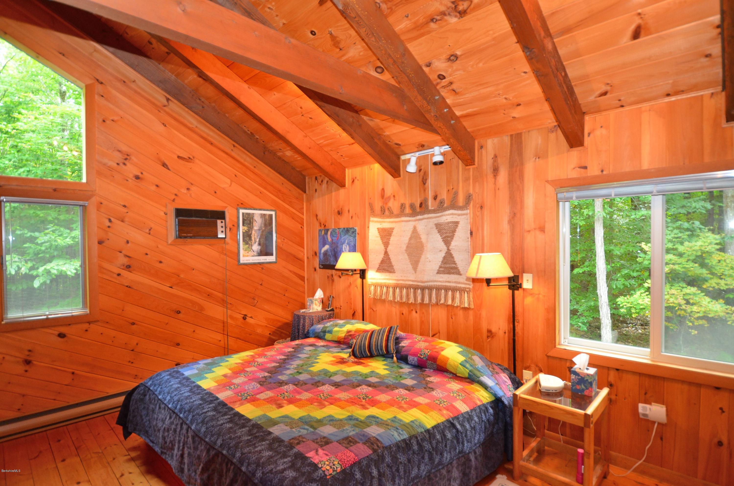 19 Cherokee Road Becket, MA 01223 - Photo 17 of 22 a bedroom with a bed and a window