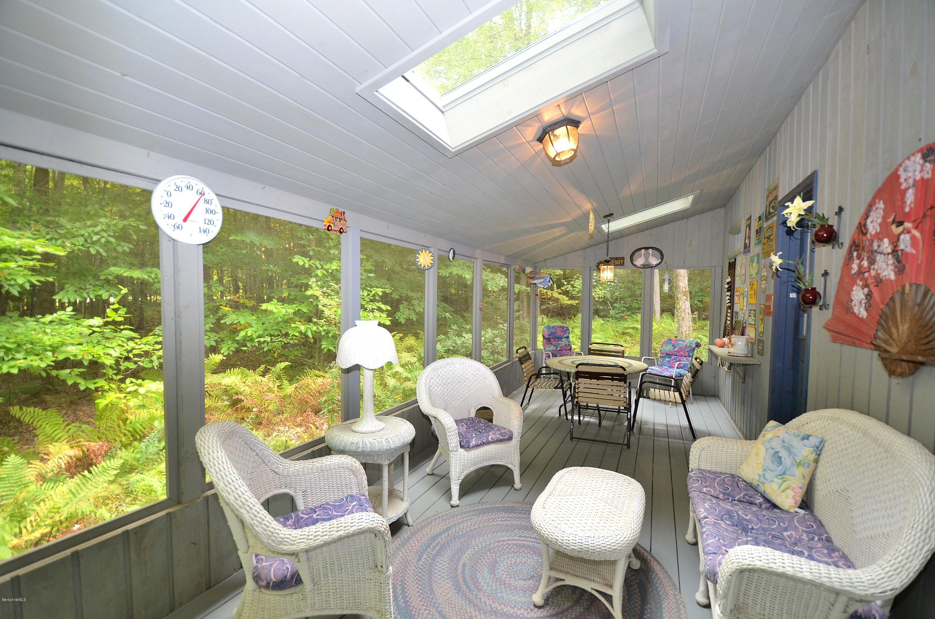 19 Cherokee Road Becket, MA 01223 - Photo 21 of 22 a living room with furniture and a large window