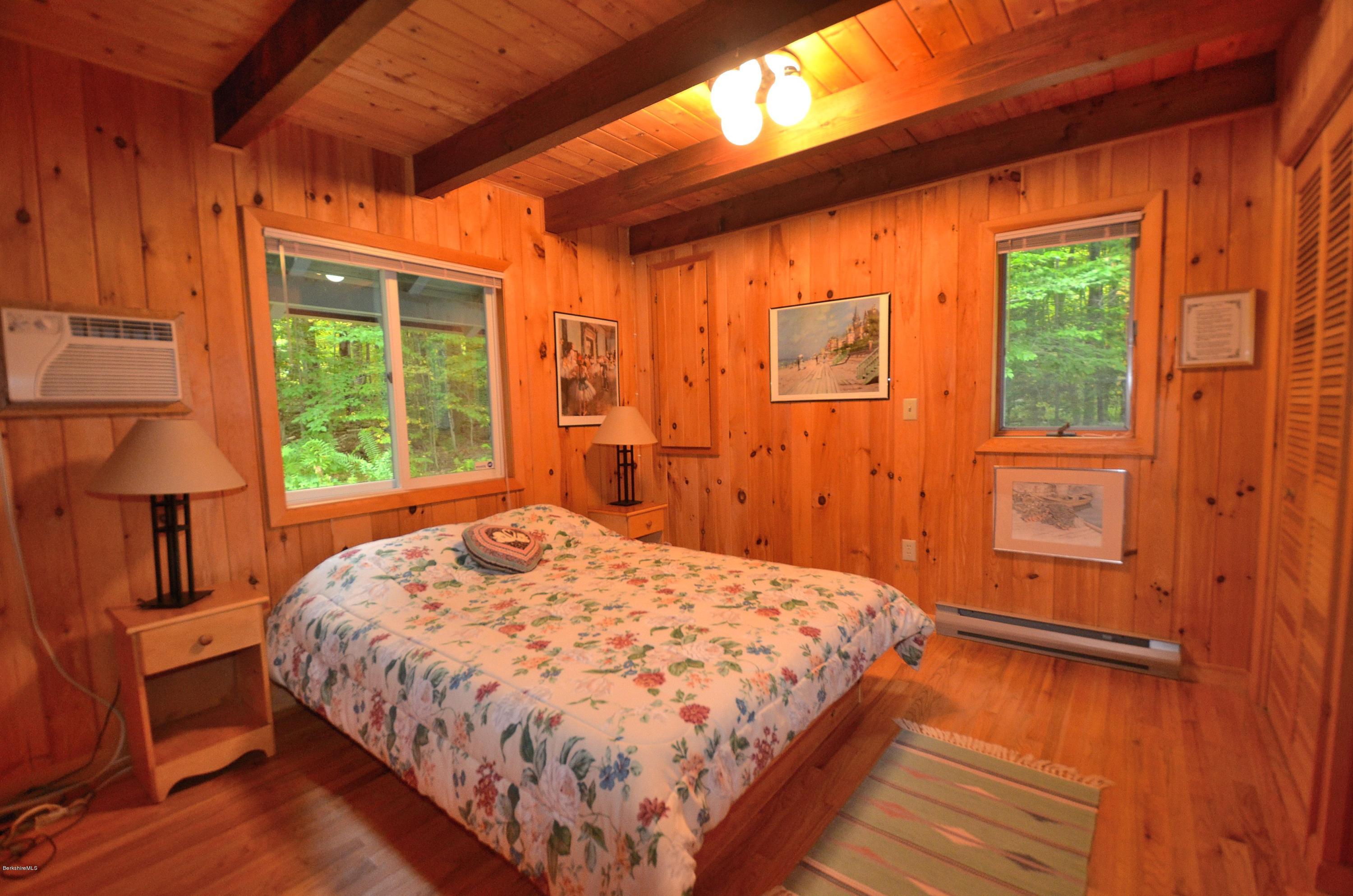 19 Cherokee Road Becket, MA 01223 - Photo 4 of 22 a bedroom with a bed and a window
