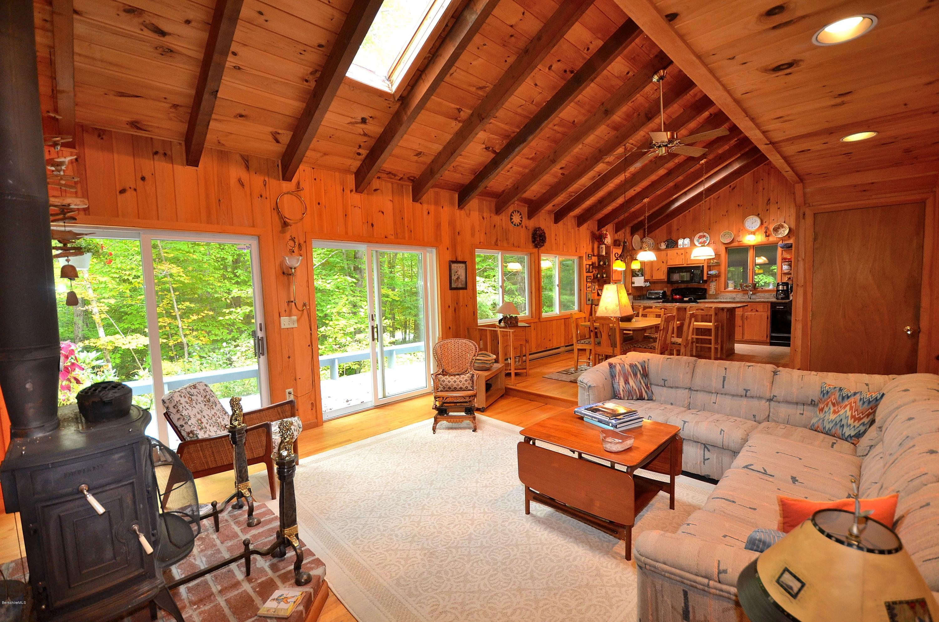 19 Cherokee Road Becket, MA 01223 - Photo 8 of 22 a living room with furniture and a large window