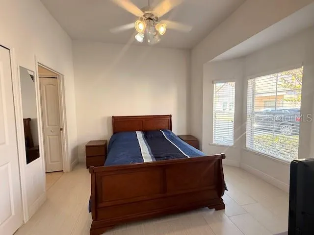 a room with a bed and a window