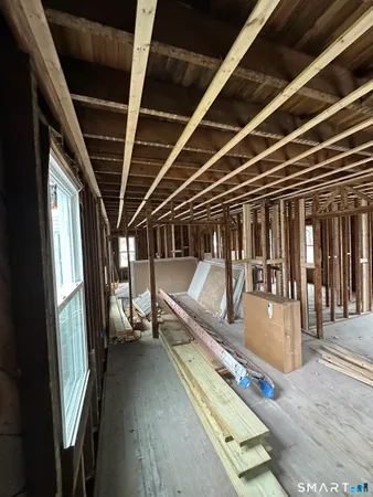 a view of a hall with wooden floor