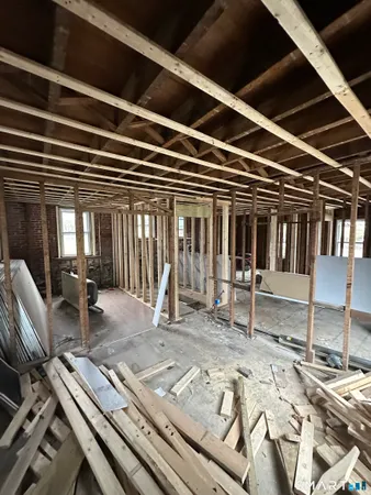 a view of a hall with wooden floor