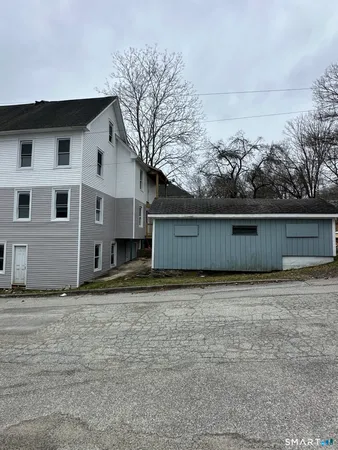 a view of front of house with a yard