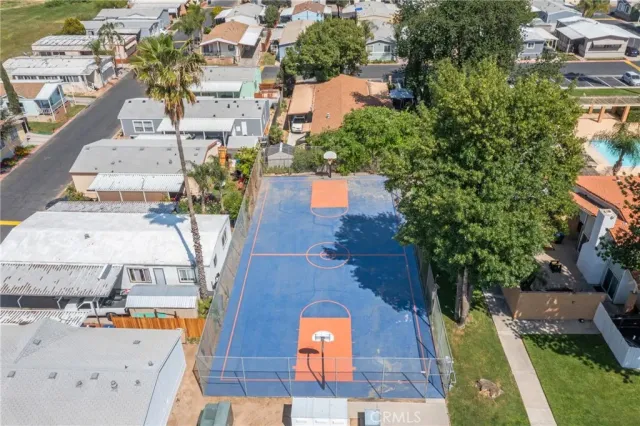 an aerial view of residential houses with outdoor space