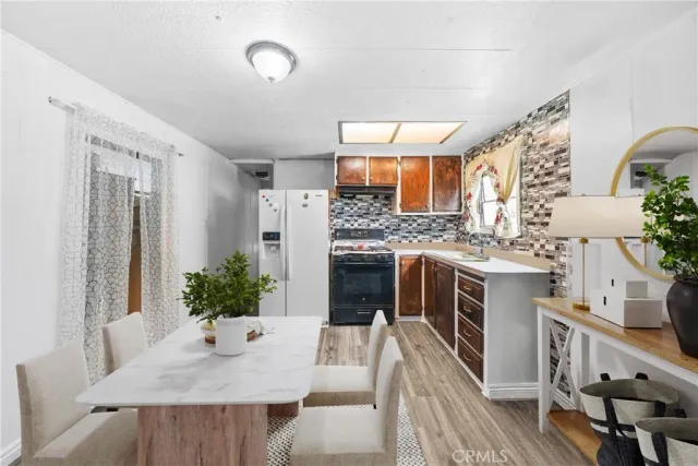 a kitchen with a table and chairs in it