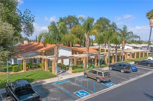 a view of a car park in front of a house