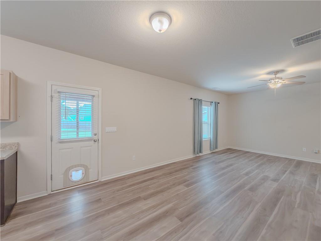 206 Morning Drive Athens, GA 30606 - Photo 9 of 36 an empty room with wooden floor and windows