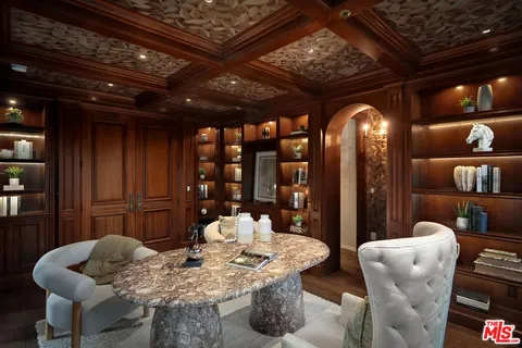 a bathroom with a granite countertop sink a mirror a vanity and shower