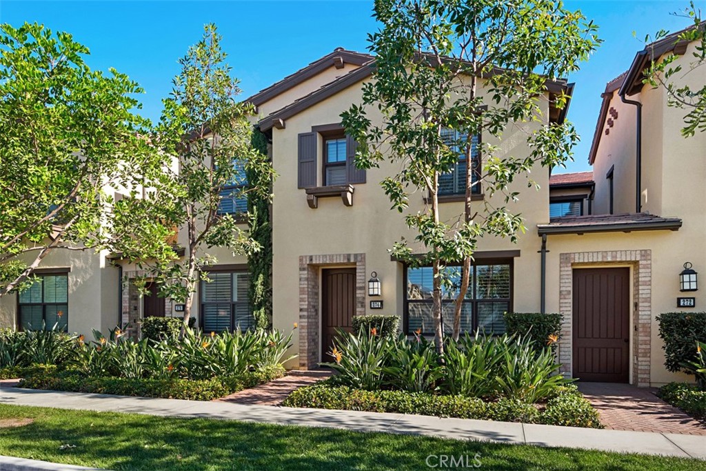 a front view of a house with a yard garage and outdoor seating