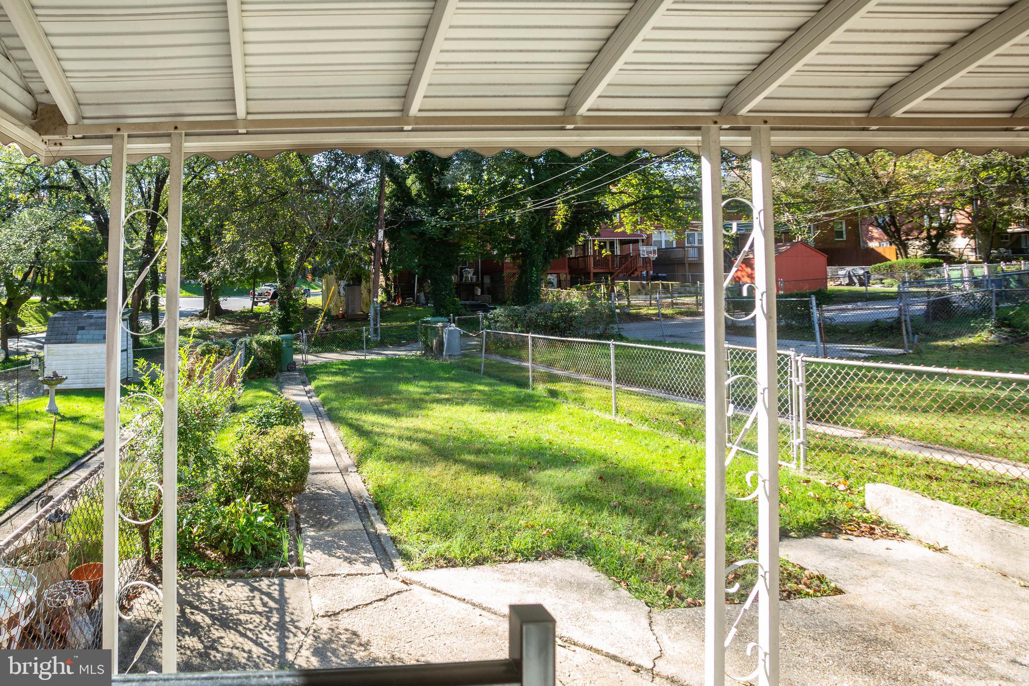 1327 Limit Avenue Baltimore, MD 21239 - Photo 2 of 24 a view of a house with a backyard and a patio