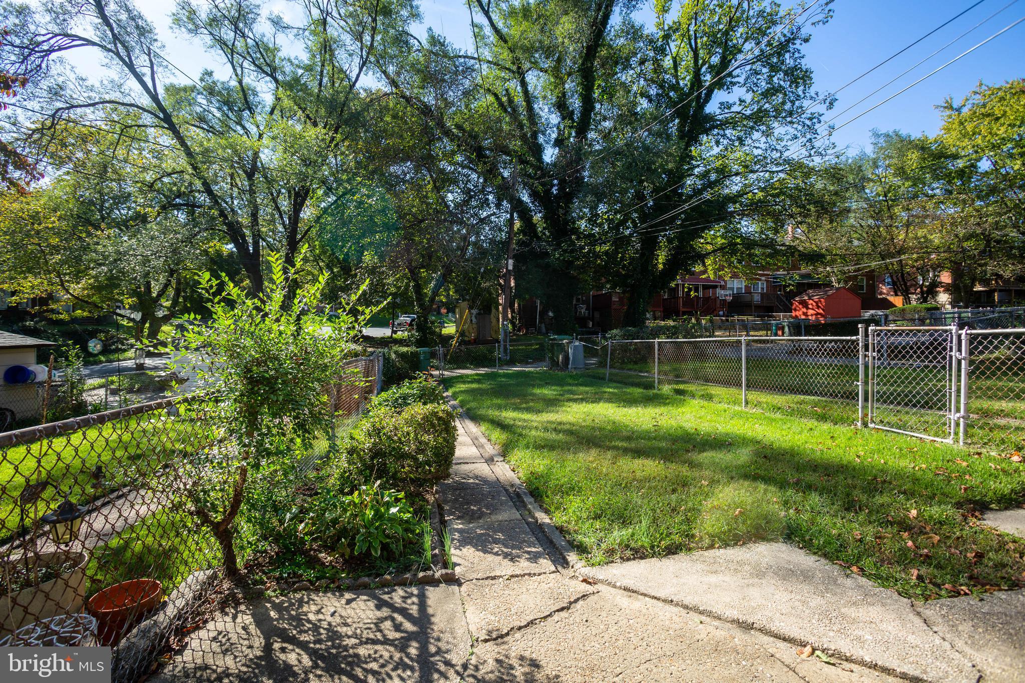 1327 Limit Avenue Baltimore, MD 21239 - Photo 3 of 24 a view of a park with large trees
