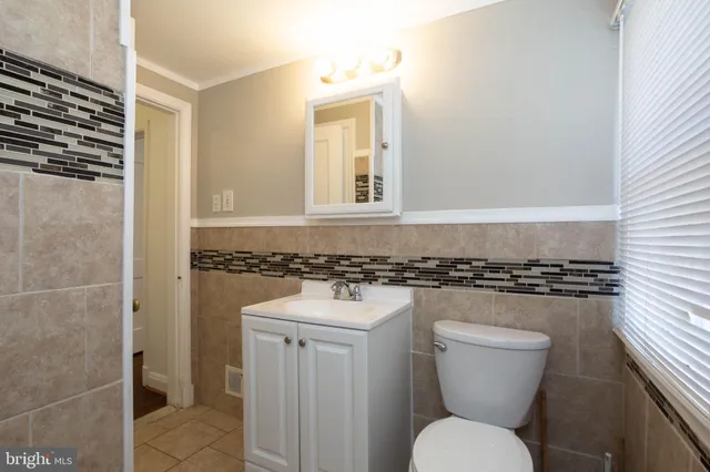 a bathroom with a toilet a sink and a shower