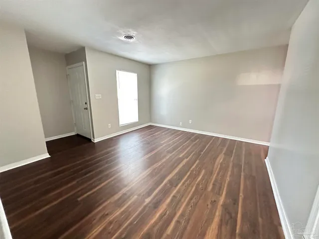 a kitchen with a sink cabinets and stainless steel appliances