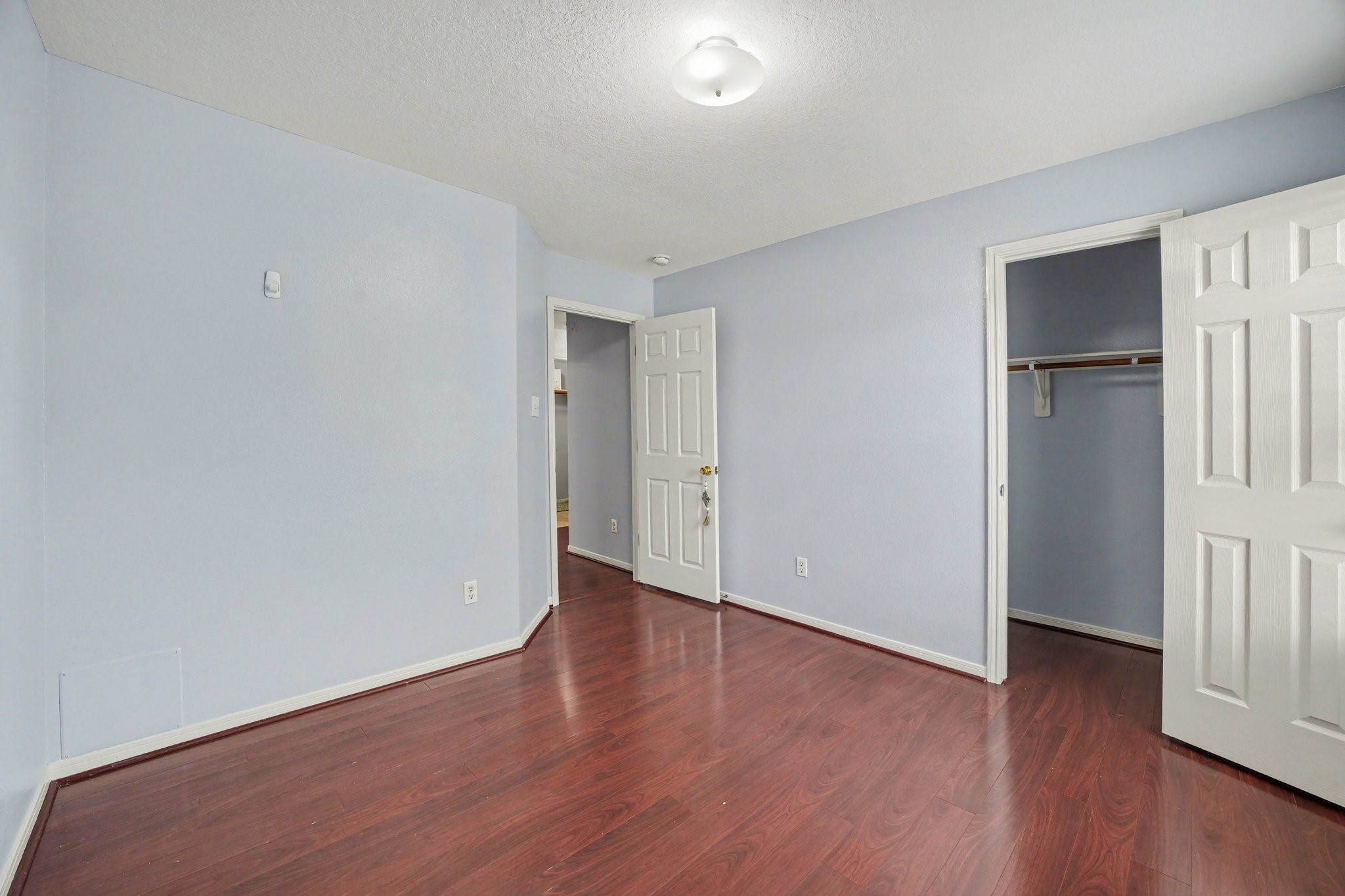 5622 Wasabi Lane Baytown, TX 77521 - Photo 21 of 29 a view of an empty room with wooden floor and closet