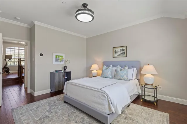 a bedroom with a bed and a lamp on table