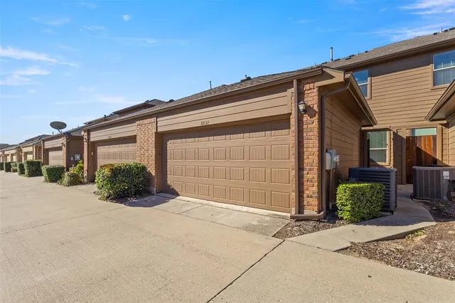 a view of a park with large trees