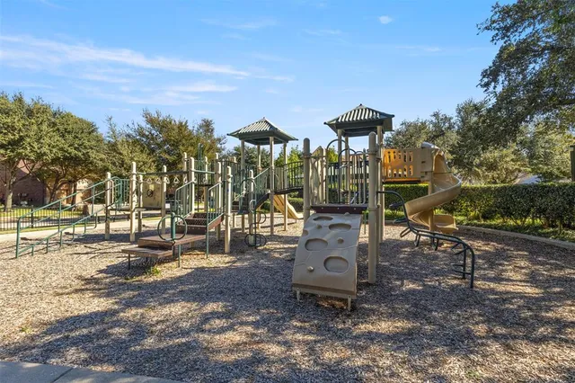 a view of a park with iron fence