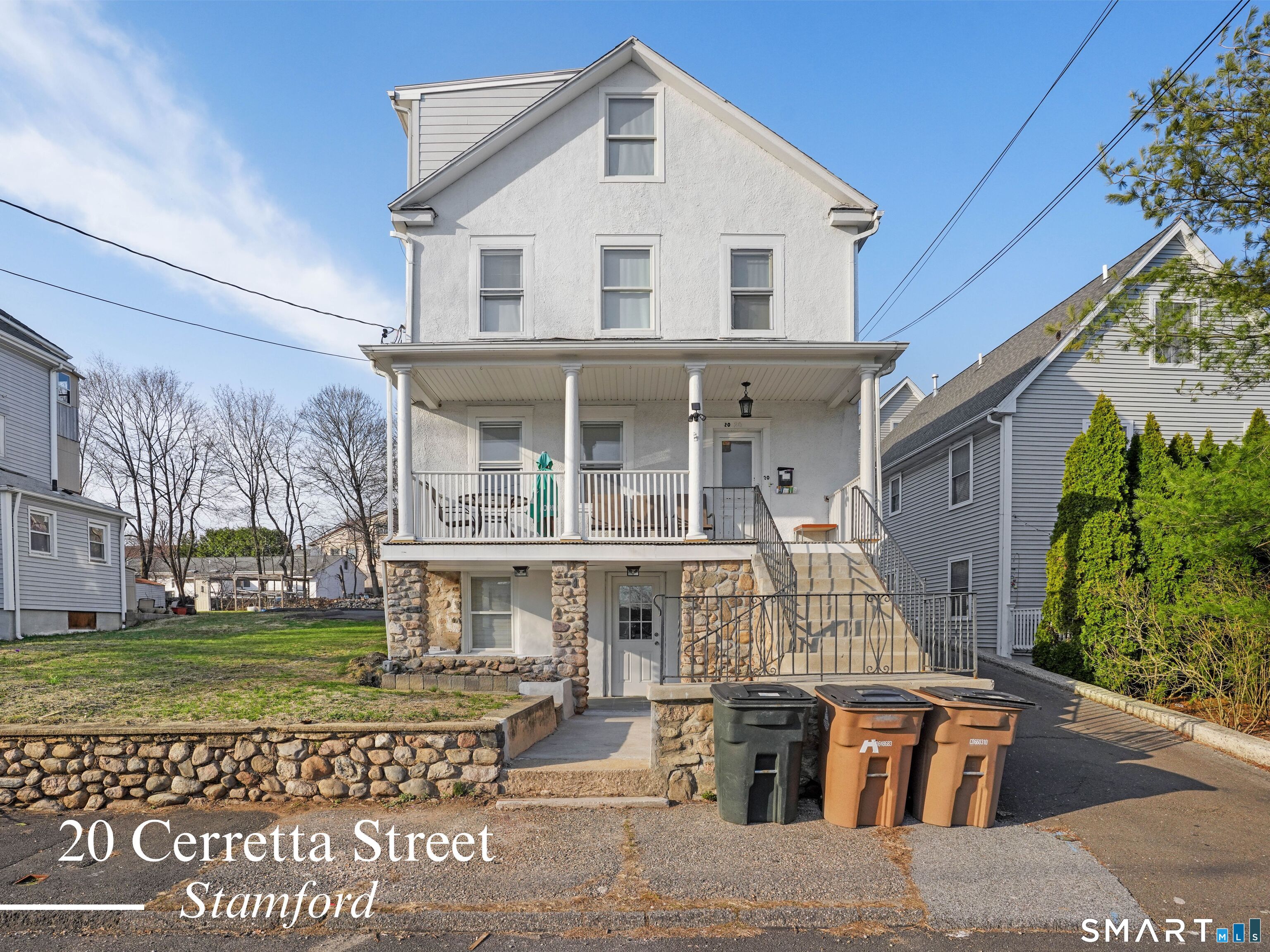 20 Cerretta Street Stamford, CT 06907 - Photo 1 of 22 a front view of a house with garden